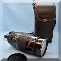 E30. Sigma Telephoto lens in case 67mm - $90